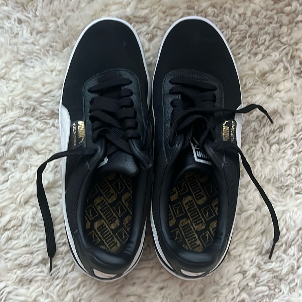 Puma "California" sneakers. Black with white and gold accents. Men's US Size 10